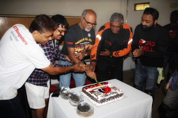 Senior Riders cutting the cake